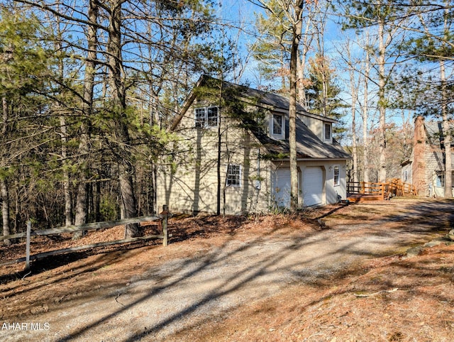 view of property exterior with a garage