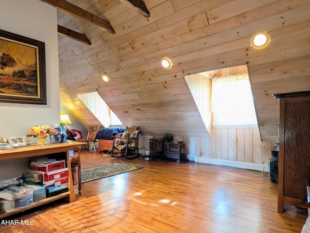 bonus room with wood ceiling, light hardwood / wood-style flooring, and lofted ceiling with beams