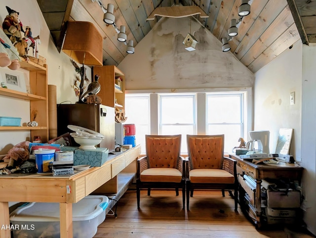 interior space featuring lofted ceiling, a healthy amount of sunlight, hardwood / wood-style floors, and wooden ceiling