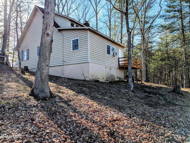 view of property exterior with a deck