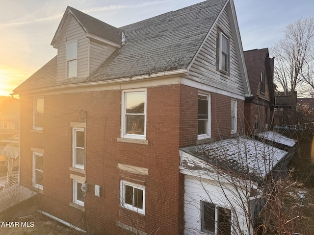 view of property exterior at dusk