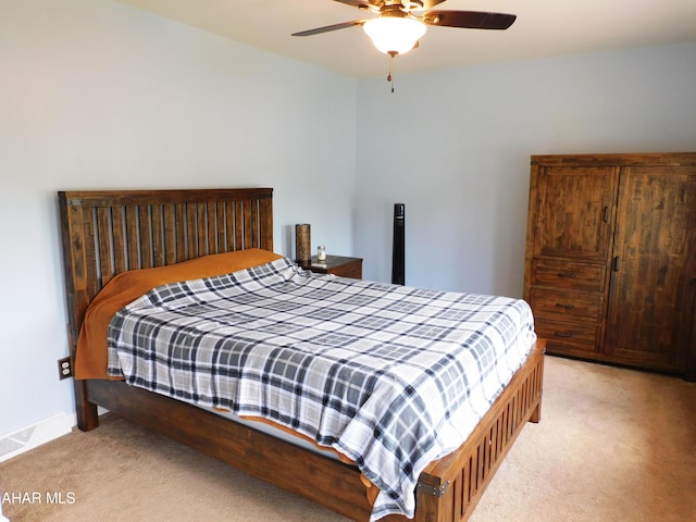 bedroom with light colored carpet and ceiling fan