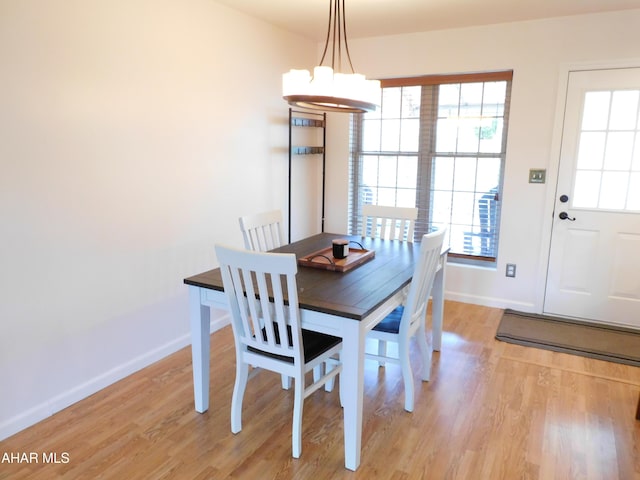 dining room featuring a chandelier and light hardwood / wood-style floors