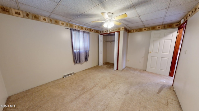 602 5th Ave, Altoona, PA 16602 - unfurnished bedroom featuring carpet flooring, a drop ceiling, a closet, and ceiling fan