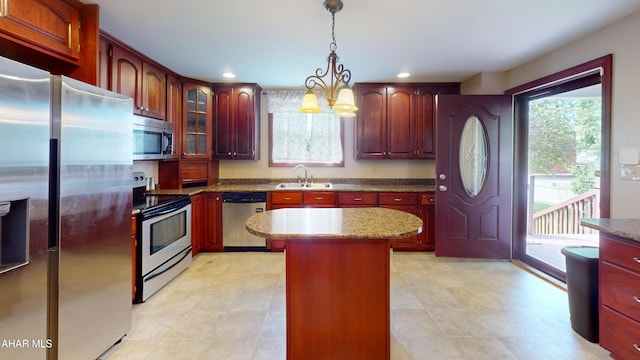 602 5th Ave, Altoona, PA 16602 - kitchen with appliances with stainless steel finishes, a sink, a chandelier, pendant lighting, and dark brown cabinets