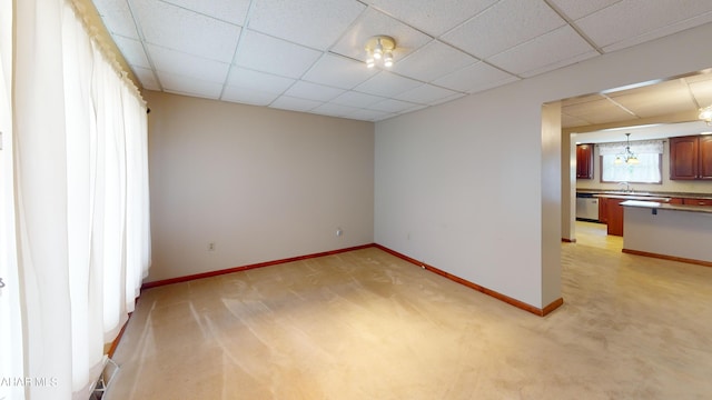 602 5th Ave, Altoona, PA 16602 - spare room featuring a sink, light carpet, baseboards, and a drop ceiling