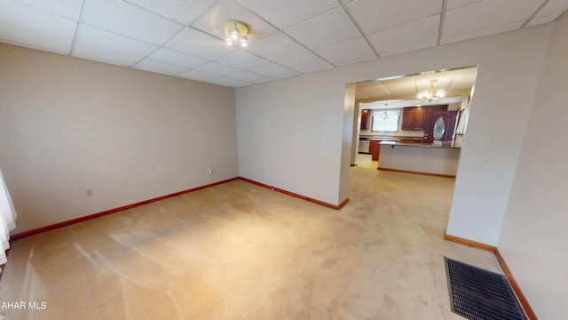 602 5th Ave, Altoona, PA 16602 - spare room featuring baseboards, light colored carpet, and a drop ceiling