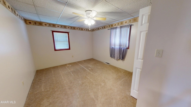 602 5th Ave, Altoona, PA 16602 - empty room with healthy amount of natural light, a ceiling fan, light colored carpet, and a drop ceiling