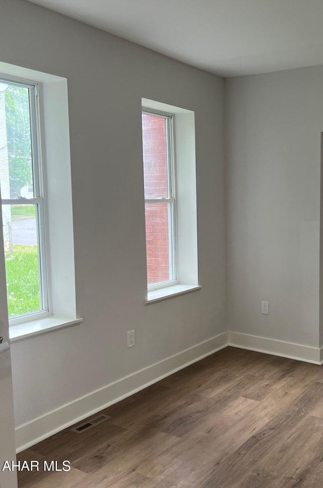 2306 5th Ave, Altoona, PA 16602 - unfurnished room with healthy amount of natural light, dark wood-type flooring, and baseboards