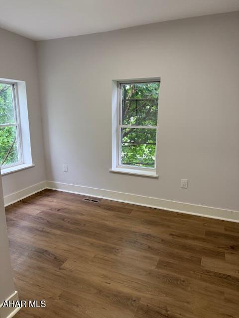 2306 5th Ave, Altoona, PA 16602 - unfurnished room with dark wood-style flooring and baseboards