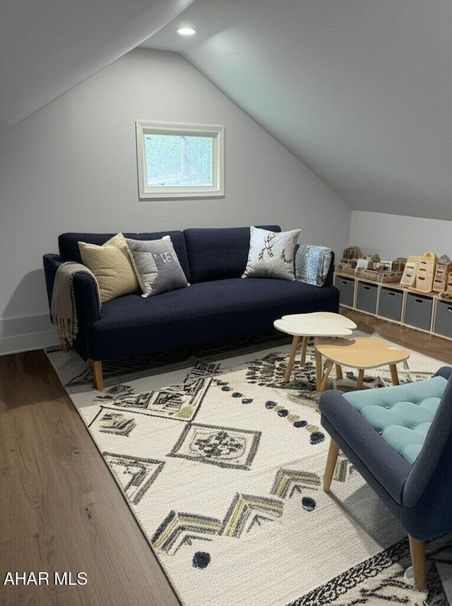 2306 5th Ave, Altoona, PA 16602 - living room featuring wood finished floors, vaulted ceiling, recessed lighting, and baseboards