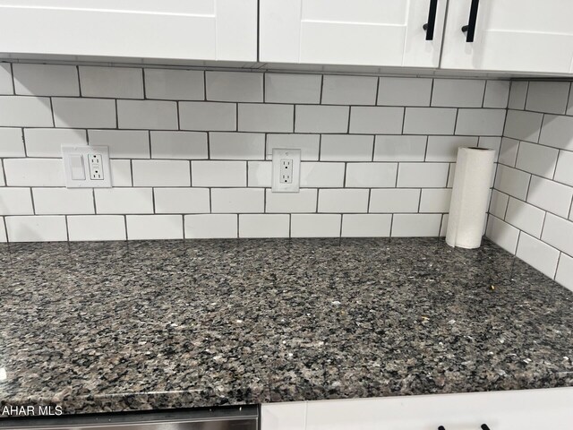 2306 5th Ave, Altoona, PA 16602 - kitchen view of white cabinets, backsplash, and dark stone counters