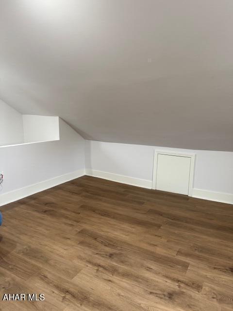 2306 5th Ave, Altoona, PA 16602 - additional living space featuring lofted ceiling, wood finished floors, and baseboards