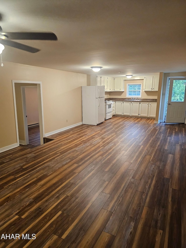 2754 Everett Rd, East Freedom, PA 16637 - unfurnished living room featuring dark wood-style floors, a ceiling fan, baseboards, and a baseboard heating unit