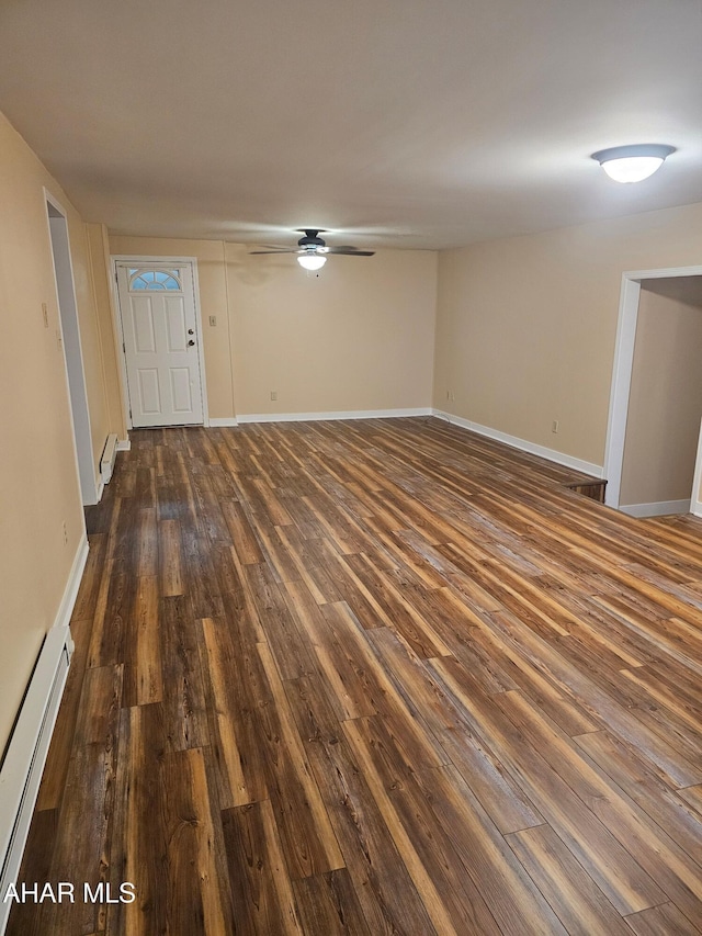 2754 Everett Rd, East Freedom, PA 16637 - unfurnished living room featuring a baseboard radiator, dark wood-style floors, a ceiling fan, and baseboards