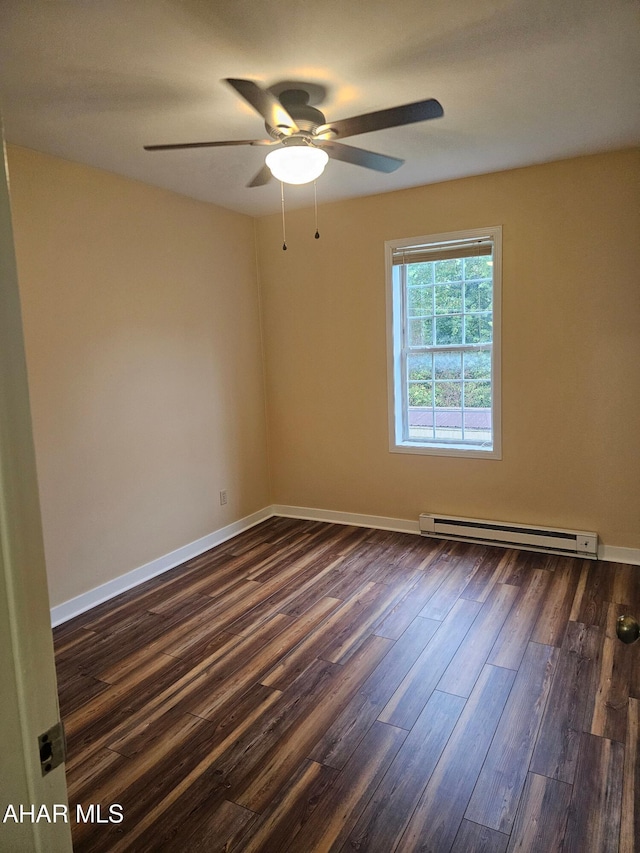 2754 Everett Rd, East Freedom, PA 16637 - unfurnished room with a baseboard radiator, dark wood finished floors, baseboards, and a ceiling fan