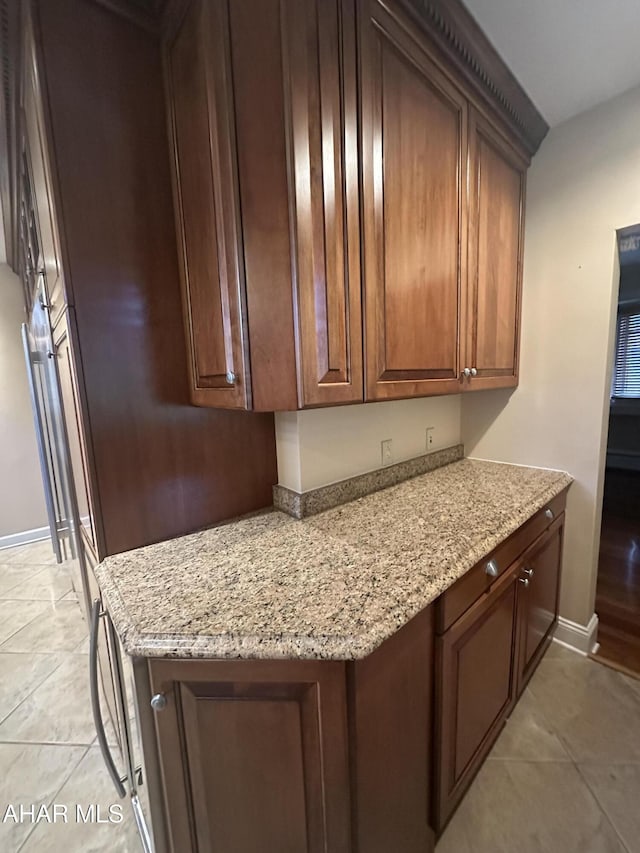 3405 Crescent Rd, Altoona, PA 16602 - kitchen with light stone counters, light tile patterned flooring, and baseboards
