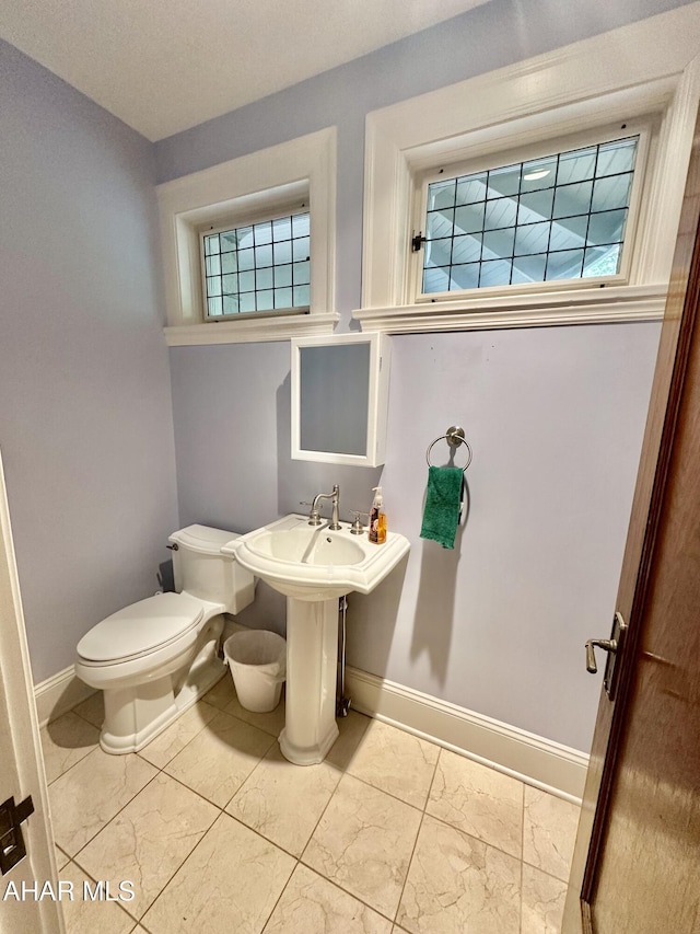 3405 Crescent Rd, Altoona, PA 16602 - bathroom with baseboards, toilet, and marble finish floors