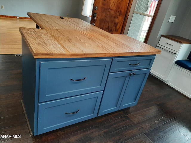 735 N Julian St, Ebensburg, PA 15931 - detailed view of butcher block counters, blue cabinetry, dark wood-style floors, and a kitchen island