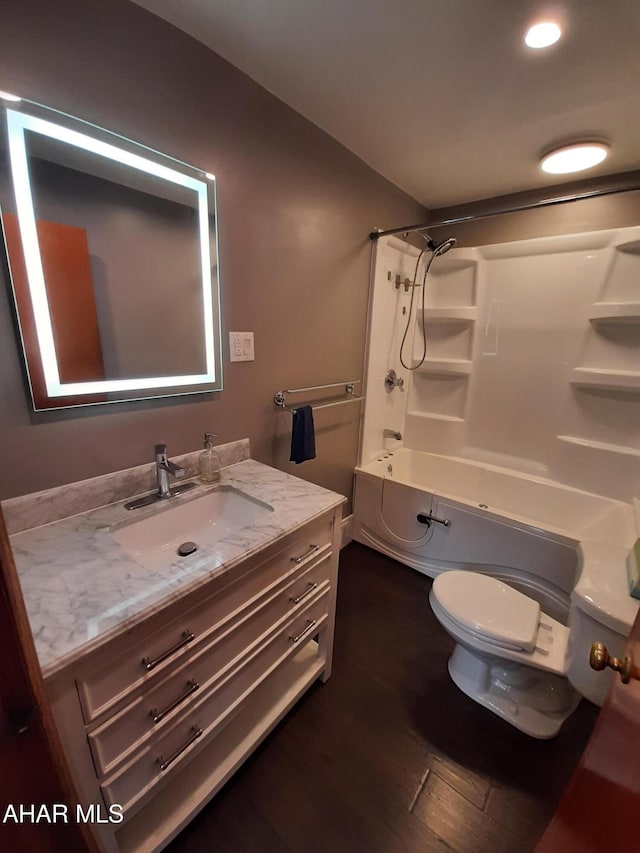 735 N Julian St, Ebensburg, PA 15931 - full bath with toilet, vanity, shower / bathtub combination, wood finished floors, and recessed lighting