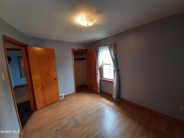 735 N Julian St, Ebensburg, PA 15931 - unfurnished bedroom featuring a closet, light wood-style flooring, and baseboards