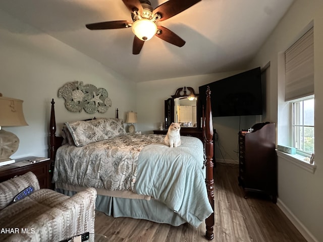 bedroom featuring hardwood / wood-style flooring, ceiling fan, and vaulted ceiling