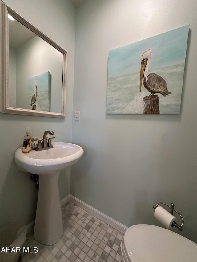 bathroom with sink and toilet