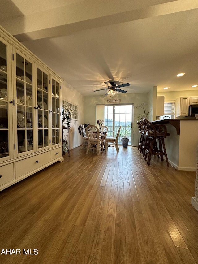 interior space featuring ceiling fan and hardwood / wood-style flooring