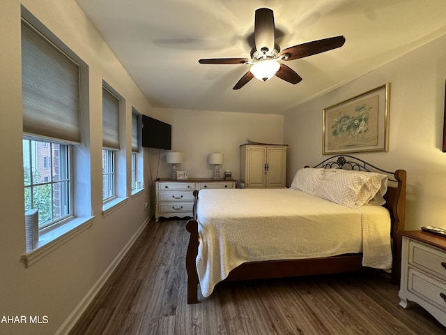 bedroom featuring ceiling fan and dark wood-type flooring