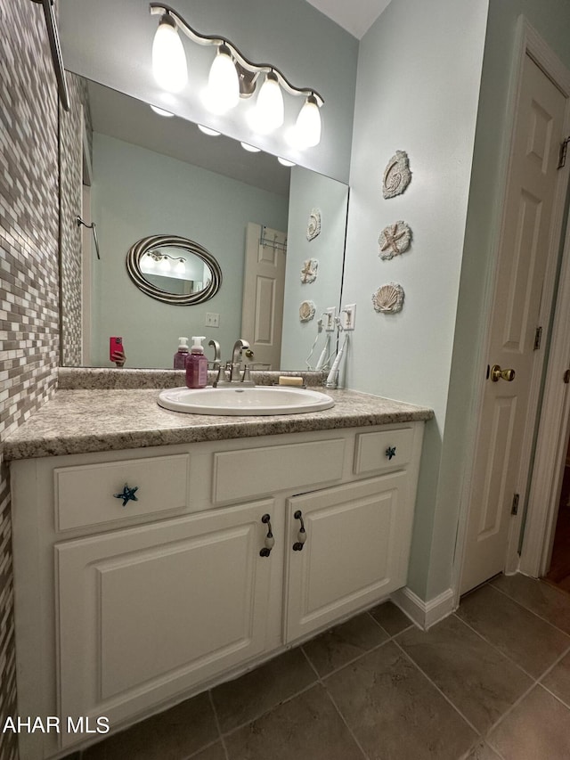 bathroom with tile patterned flooring and vanity