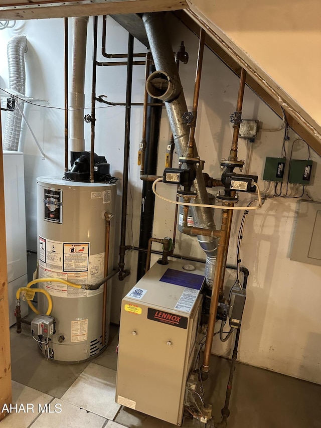 utility room featuring water heater