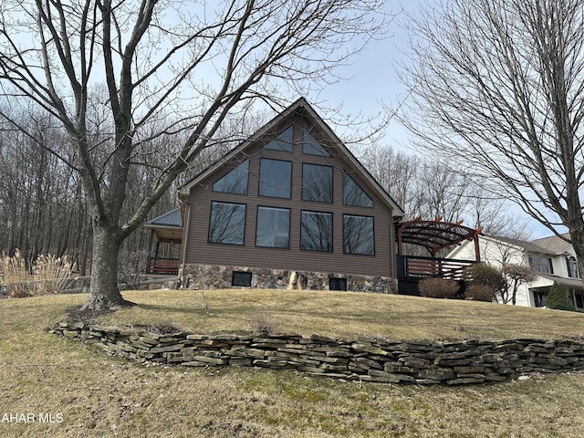 rear view of house with a lawn