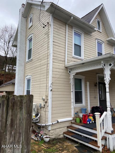 view of home's exterior featuring a porch