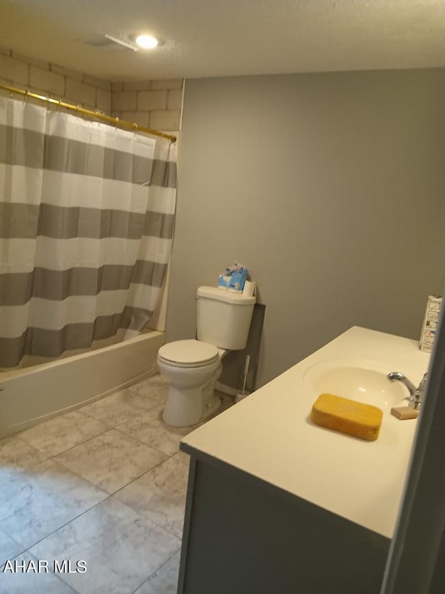 full bathroom featuring shower / bathtub combination with curtain, vanity, and toilet