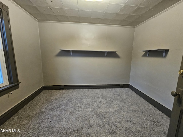 empty room with carpet flooring and baseboards