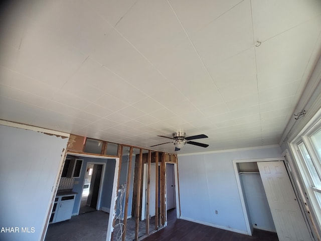 unfurnished bedroom with ceiling fan and crown molding