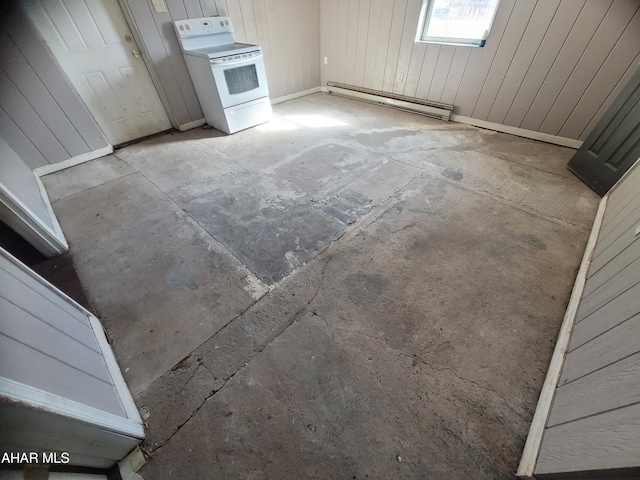 interior space with wood walls, white electric stove, and a baseboard heating unit