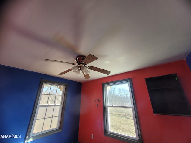 interior space featuring ceiling fan