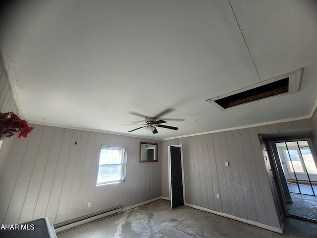 unfurnished room featuring a baseboard heating unit, baseboards, a ceiling fan, and crown molding