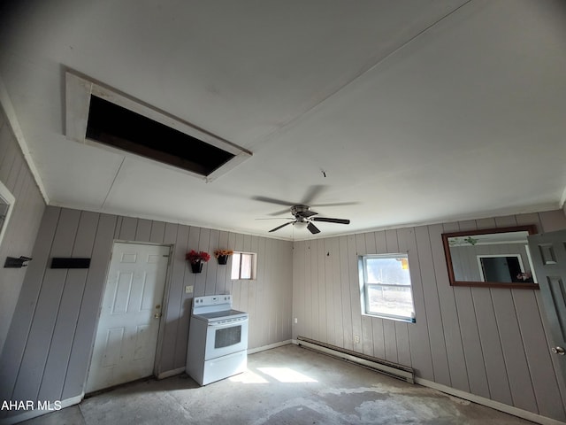 spare room featuring baseboards, baseboard heating, and a ceiling fan