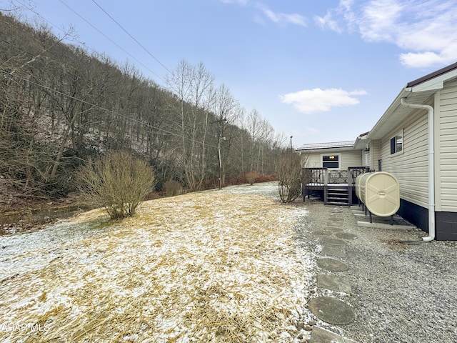 view of yard featuring a wooden deck