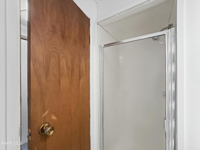 bathroom featuring an enclosed shower