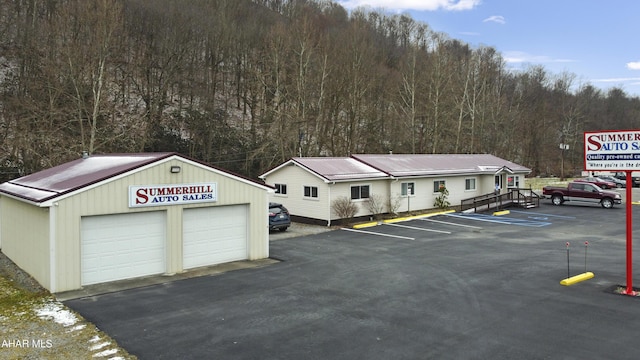 view of car parking with a garage