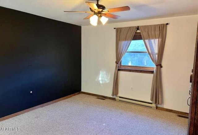 empty room with ceiling fan and baseboard heating