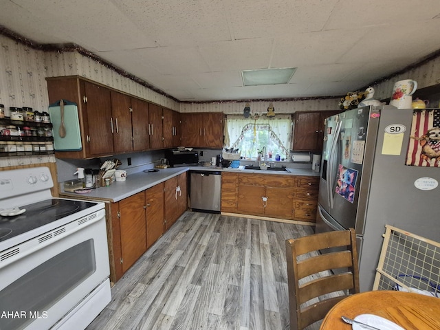 1429 Everett Rd, East Freedom, PA 16637 - kitchen with stainless steel appliances, light wood-style floors, and light countertops