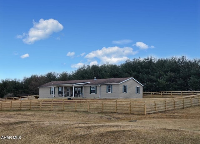 view of front of property featuring fence