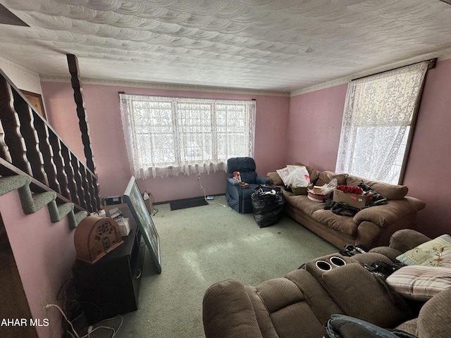 carpeted living room with a textured ceiling