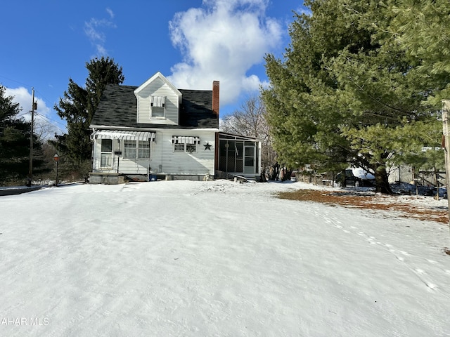 view of front of home with a sunroom