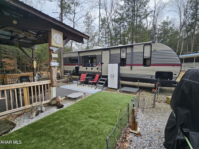 back of house with a patio and a yard