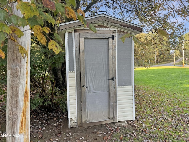 view of outdoor structure with a lawn